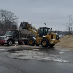 Deroma Construction team working with a CAT loader